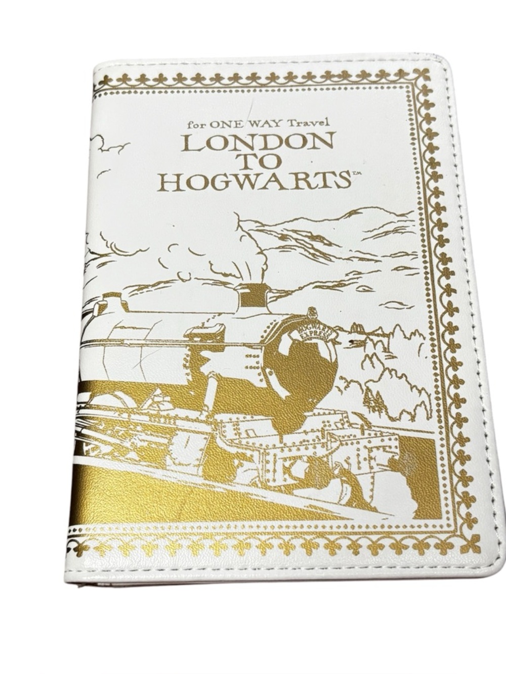 Harry Potter "London to Hogwarts" faux leather passport holder. Wizarding World